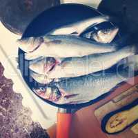 Fresh Fish In A Frying Pan On The Table