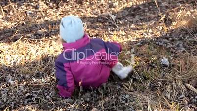 Little Girl sliding on the dry slope