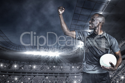 Composite image of sportsman with clenched fist after victory