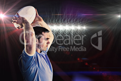 Composite image of rugby player about to throw a rugby ball