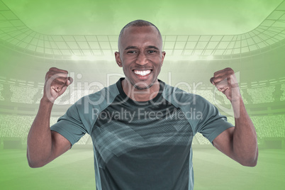 Composite image of portrait of rugby player cheering after succe