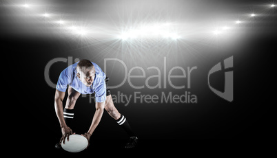 Composite image of rugby player holding ball while playing