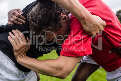 Rugby players doing a scrum