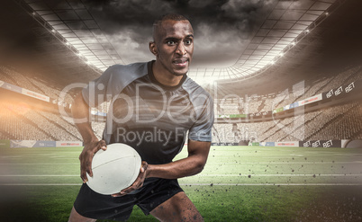 Composite image of rugby player in position to throw ball