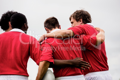 Rugby players celebrating a win