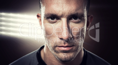 Composite image of close-up portrait of serious rugby player