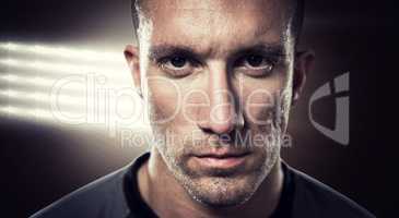 Composite image of close-up portrait of serious rugby player