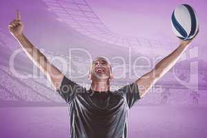 Composite image of successful rugby player holding ball with arm