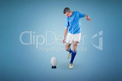 Composite image of rugby player doing a drop kick