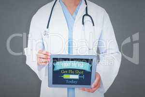 Composite image of doctor showing tablet pc