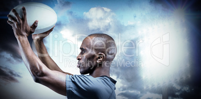 Composite image of athlete in position of throwing rugby ball