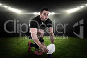 Composite image of rugby player getting ready to kick ball