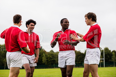 Rugby players celebrating a win