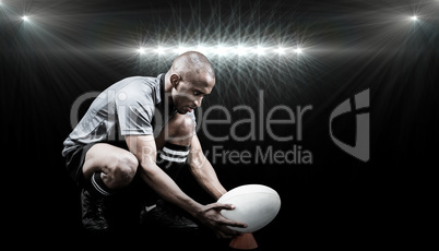 Composite image of rugby player keeping ball on kicking tee