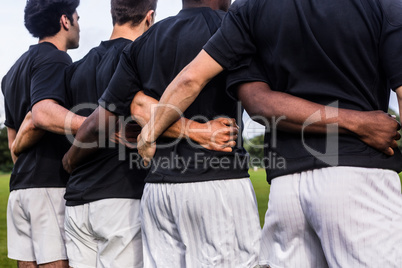 Rugby players standing together before match