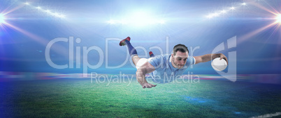 Composite image of rugby player scoring a try