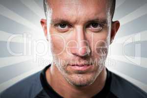 Composite image of close-up portrait of serious rugby player