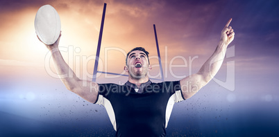 Composite image of rugby player cheering with the ball