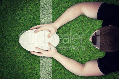 Composite image of a rugby player scoring a try