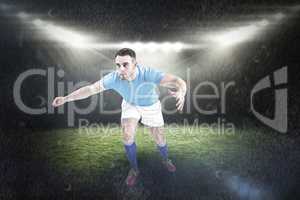 Composite image of rugby player ready to tackable
