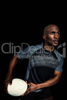Composite image of confident athlete in position to throw rugby ball
