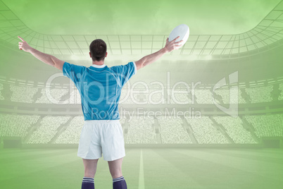 Composite image of rugby player about to throw a rugby ball