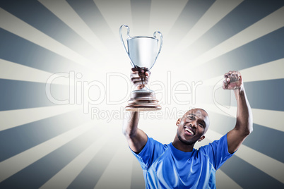 Composite image of happy sportsman looking up and cheering while