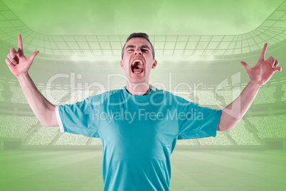 Composite image of rugby player gesturing fingers crossed
