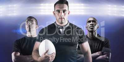 Composite image of tough rugby player holding ball