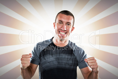 Composite image of portrait of happy rugby player