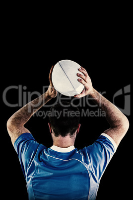 Composite image of rugby player about to throw a rugby ball