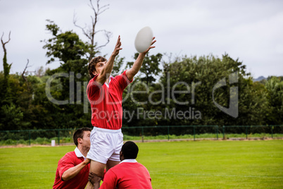 Rugby players jumping for line out