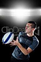 Composite image of sports player catching the ball