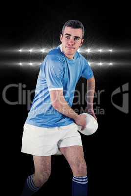 Composite image of rugby player about to throw a rugby ball