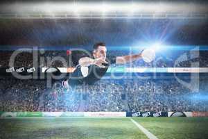 Composite image of rugby player scoring a try