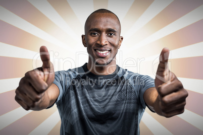 Composite image of portrait of confident athlete smiling and showing thumbs up