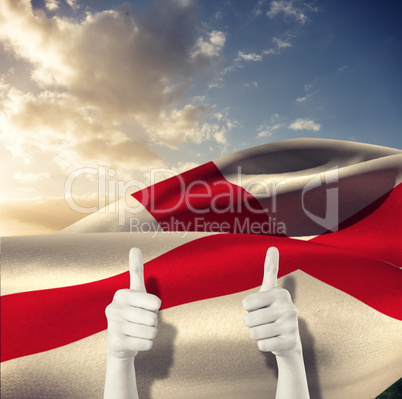 Composite image of businesswomans hands showing thumbs up