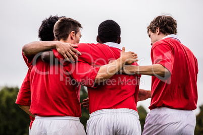 Rugby players celebrating a win