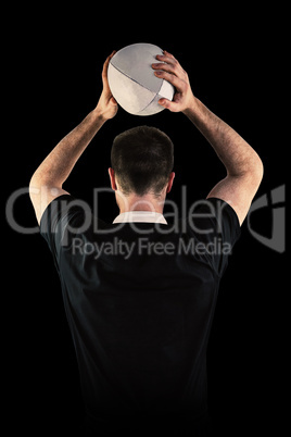 Composite image of rugby player about to throw a rugby ball