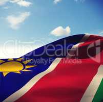 Composite image of close-up of namibia flag waving