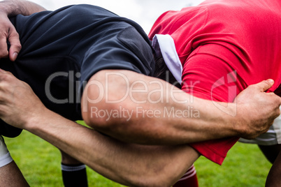 Rugby players doing a scrum