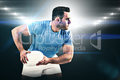 Composite image of rugby player throwing the ball