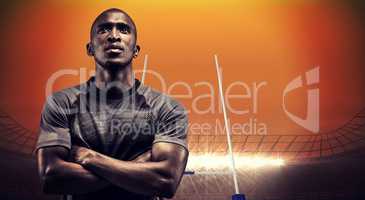 Composite image of thoughtful athlete standing with arms crossed