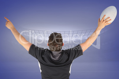 Composite image of back turned rugby player gesturing victory