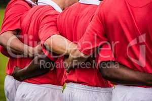 Rugby players standing together before match