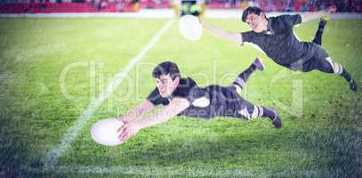 Composite image of a rugby player scoring a try