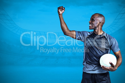 Composite image of sportsman with clenched fist after victory