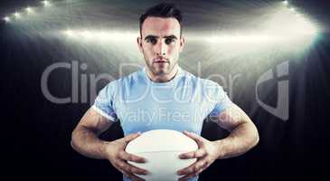 Composite image of rugby player looking at camera