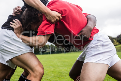 Rugby players doing a scrum