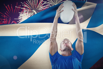 Composite image of rugby player holding ball with eyes closed